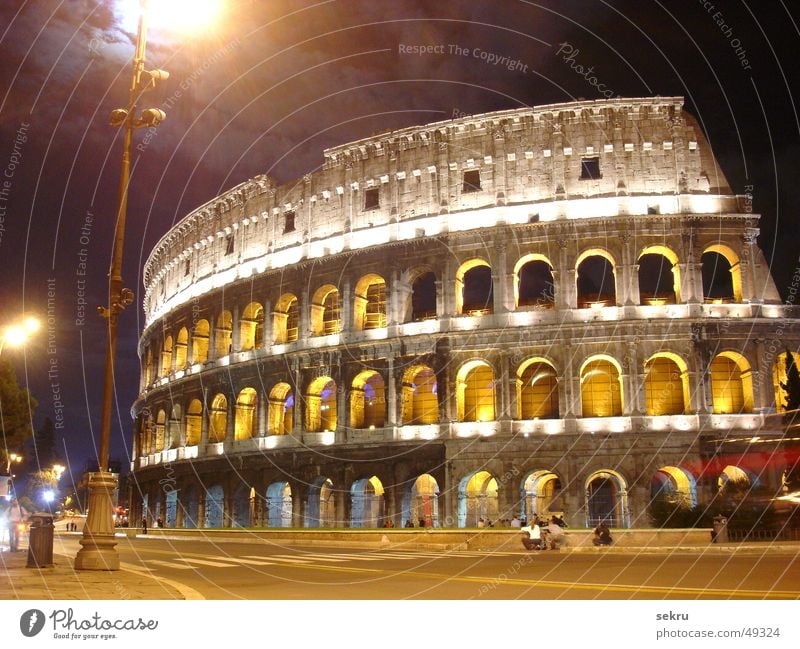 colossally Colosseum Rome Night Lighting Long exposure Dark Italy Historic Building Ruin Evening Impressive Might Lamp Street lighting Clouds Large