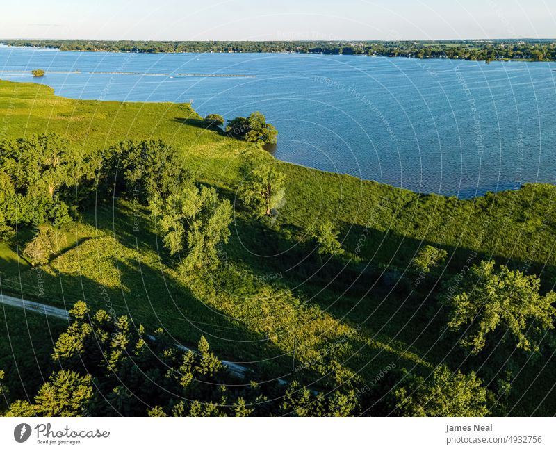 Natural View along the Fox River shoreline sunny fox river nature water day lake background summer drone midwest usa drone perspective photography wave outdoors