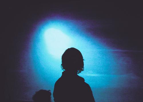 Visitors in front of blue light installation Projection screen Human being Silhouette Mysterious Feminine Exhibition Artificial light artistic Profile Shadow