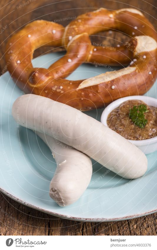 Pair of Bavarian veal sausages White sausages Veal sausage Wood hacked Couple snack two plank cute Breakfast traditionally Eating Munich nobody Pretzel Mustard