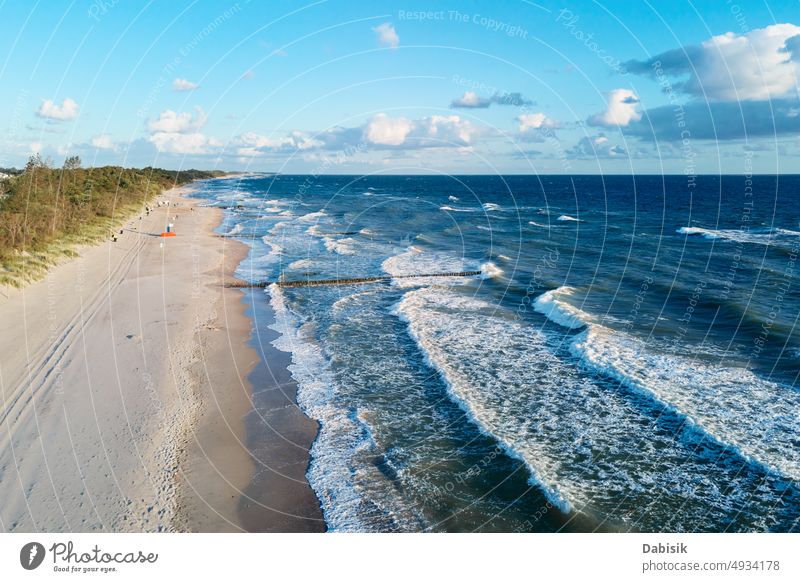 Drone view of sea coastline with sand beach blue ocean waves poland baltic park holiday background bay aerial north sandy above wind water nobody seashore