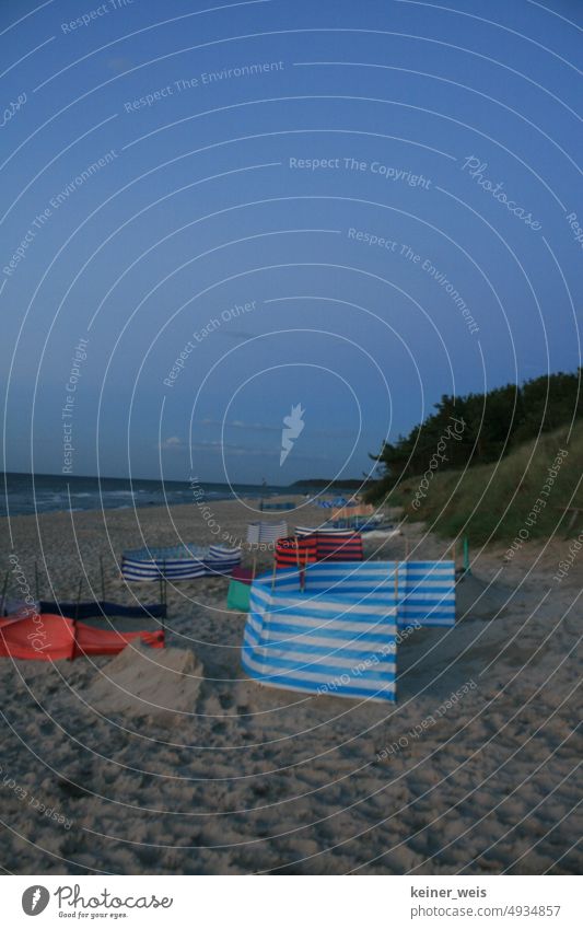 Deserted beach of the Baltic Sea with empty berths at night Beach coast Sand Ocean Sky wind deflector Relaxation Tourism Beach chair Exterior shot Calm Water