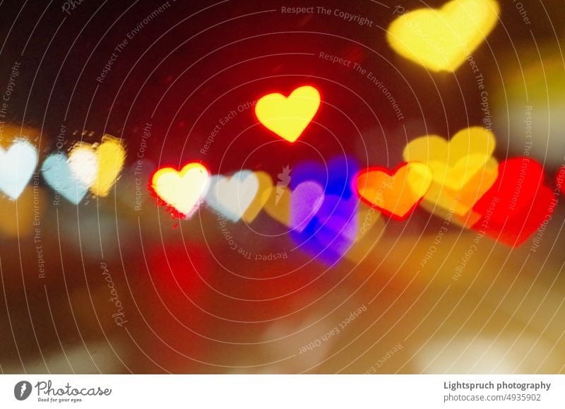 Heart-shaped bokeh seen through a window. abstract heart-shaped light romance love - emotion christmas valentine's day blur holiday bright valentine card gold