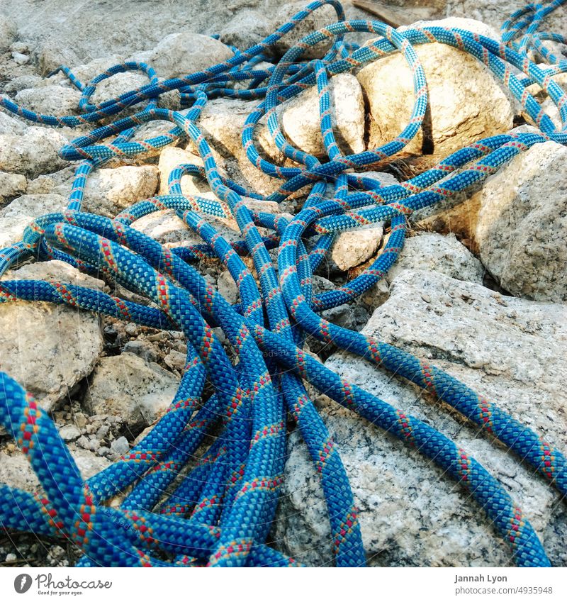 Abseiling or repelling rope for mountain climbing. safety outdoors blue rope heavy rope mountain climbing gear Climbing Rope Climbing rope Mountain Rock
