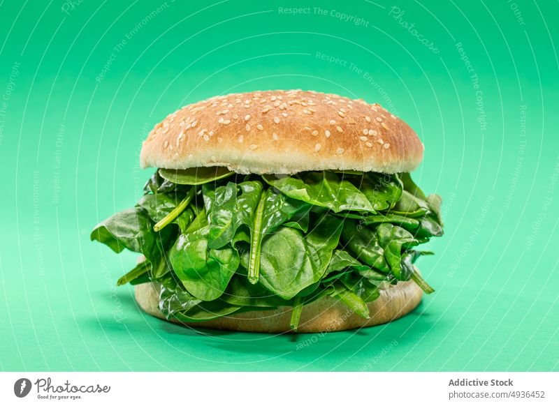 Healthy burger with spinach leaves bun healthy food fresh diet concept vegan color bright lunch culinary vivid leaf nutrition bunch vitamin portion cuisine