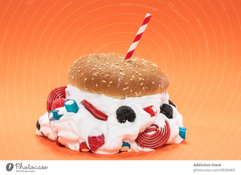 Burger with whipped cream and gummies burger gummy straw sweet bun concept colorful bright confectionery food dessert jelly fast food candy tasty yummy