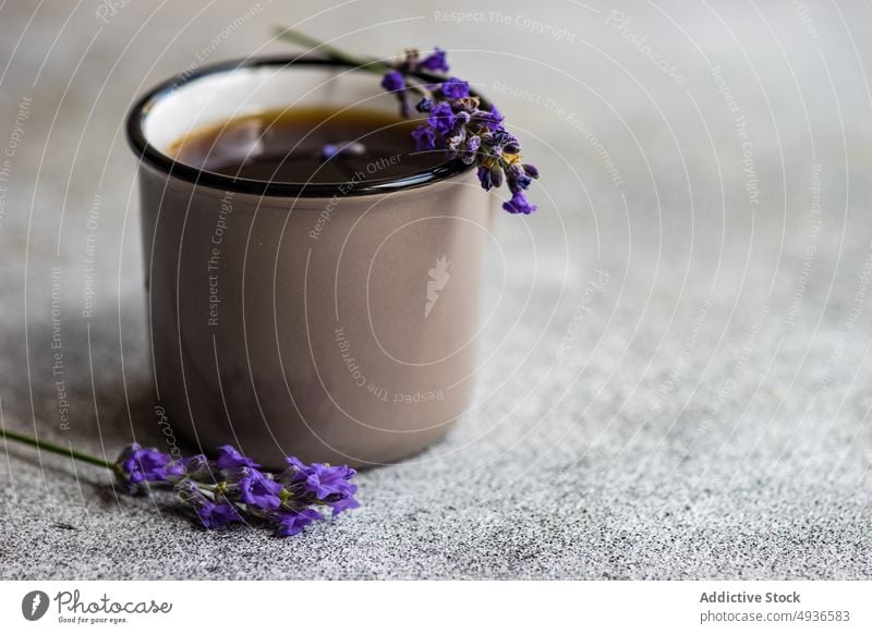 Ceramic cup of coffee with lavender beverage black caffeine ceramic concrete. background drink espresso floral flower gourmet morning mug served summer table
