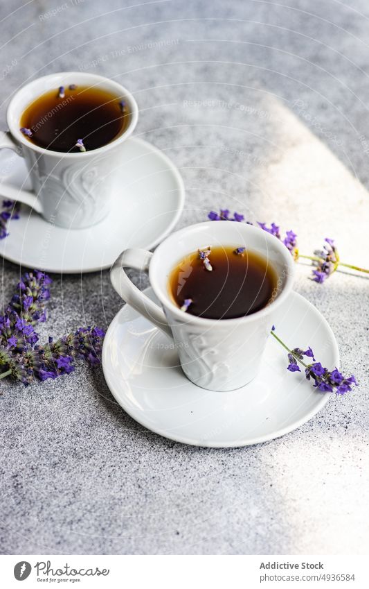 Ceramic cups of coffee with lavender beverage black caffeine ceramic concrete. background drink espresso floral flower gourmet morning mug served summer table