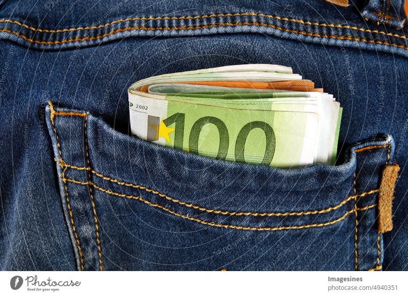 Cash. Euro banknotes in back pocket of jeans pants. Concept of wealth, saving money or spending it. Simply stealing the money. cash Banknotes Back pocket Jeans