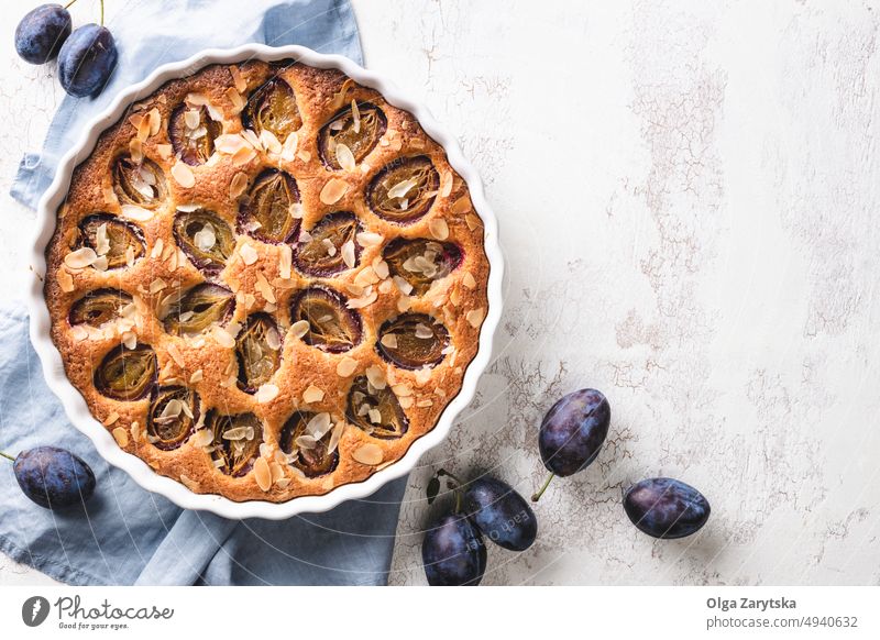 Traditional American plum torte. pie cake dessert fruit autumn american traditional table pastry food pan homemade tart cinnamon almond white top view