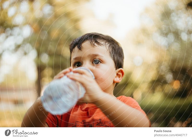 Child drinking water from bottle 3 - 8 years Infancy Colour photo Human being Day Nature Exterior shot Drinking Drinking water Portrait photograph refresh