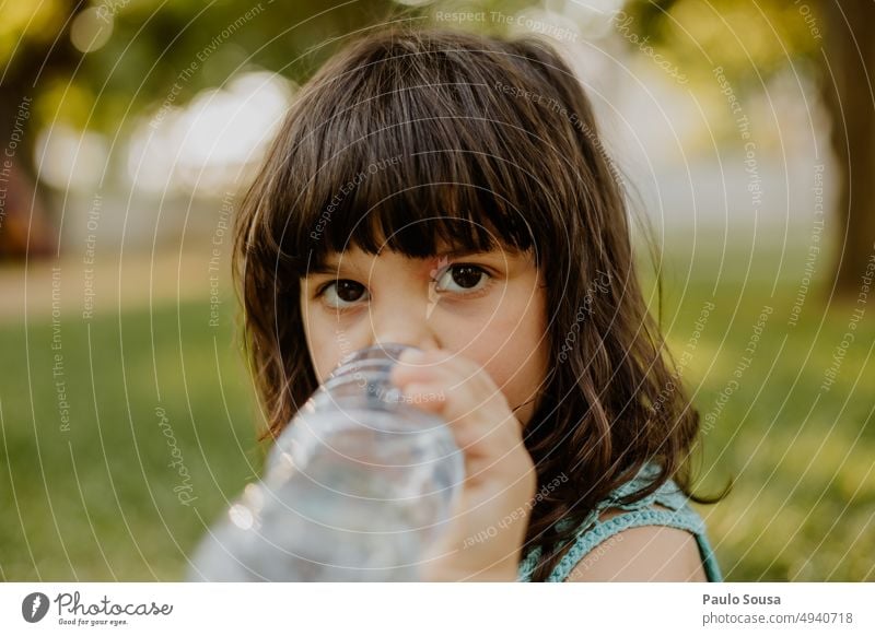Child drinking water from bottle Girl 3 - 8 years Infancy Colour photo Human being Feminine Day Nature Exterior shot Drinking Drinking water Portrait photograph