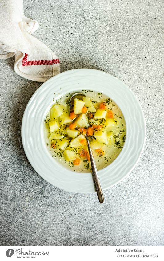 Healthy vegetable soup for dinner bowl broth carrot food healthy potato served vegan vegetarian dish tasty potatoes restaurant delicious cuisine portion spoon
