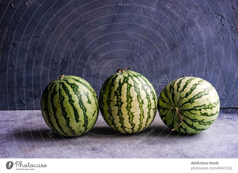 Whole fresh watermelon on dark background berry concrete dessert eat eating food fruit green healthy meal mini organic red summer whole stripe natural rustic