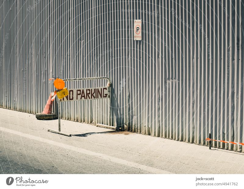 NO PARKING on the metal fence no parking Signs and labeling Word English Road sign Street Signage Traffic infrastructure Warning sign Metalware