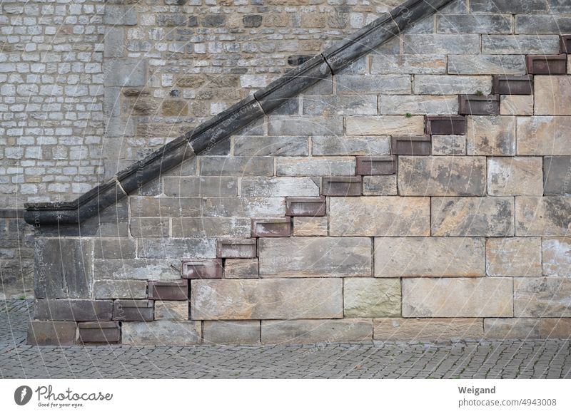 Detail view of stone wall with different grain and stairway Sandstone Wall (barrier) sandstone wall texture Yellow Brown Background picture Pattern Wood grain