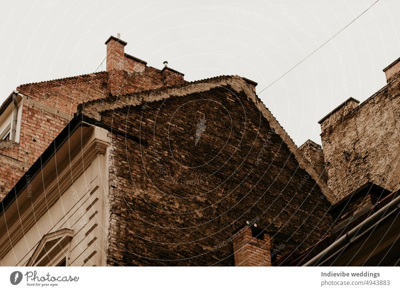 A firewall on a house building. Brick wall with chimneys. abstract antique arcade architecture brick brown city cityscape classic classical culture design