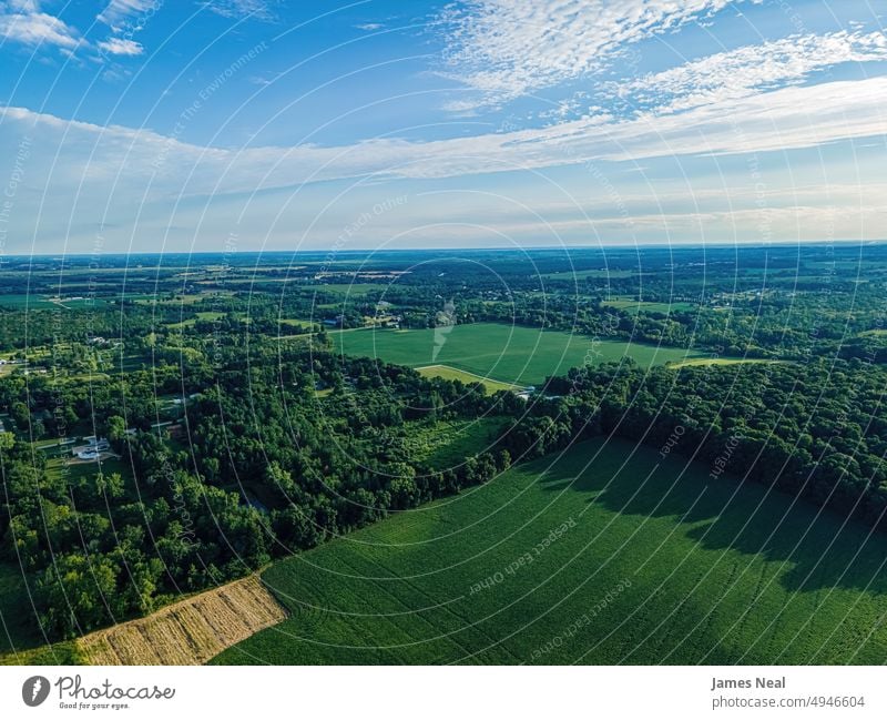 Aerial views of summertime wisconsin grass sunny natural nature day meadow hill agriculture plant drone sustainable resources growth outdoors environment yellow