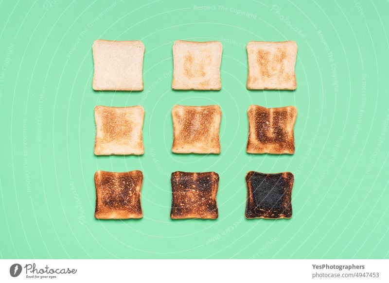 Toast bread variety top view on a green table. Types of toasted bread. above aligned arranged assortment background breakfast bright brown burn carbs color