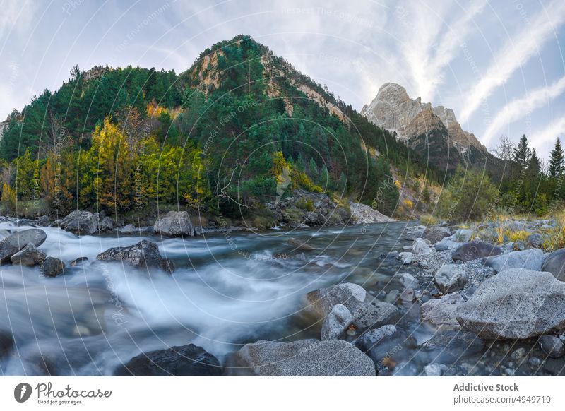 Fast river near mountains and forest autumn sky cloudy nature water rock tree huesca spain ordesa y monte perdido national park stream creek weather formation