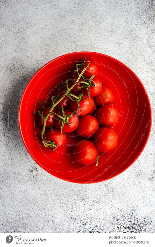 Ripe red cherry tomatoes in the bowl background concrete cook dinner eat eating food fresh healthy meal organic raw ripe seasonal table vegetable harvest