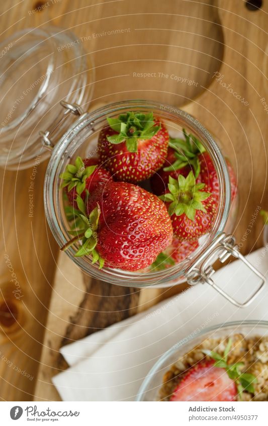 Ripe healthy strawberries served in glass jar on cutting board strawberry sweet kitchen food vitamin fresh table delicious ingredient knife daylight tasty