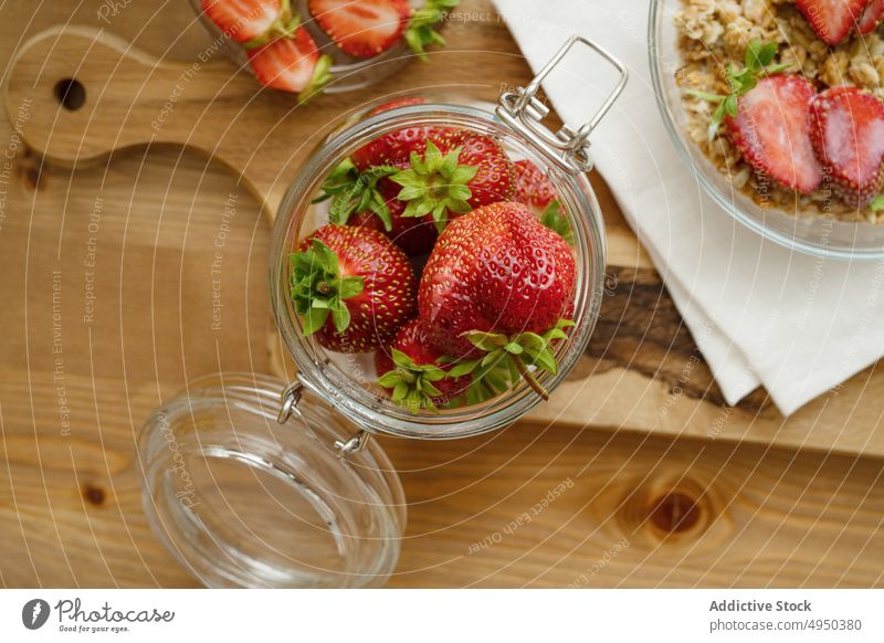 Ripe healthy strawberries served in glass jar on cutting board strawberry sweet kitchen food vitamin fresh table delicious ingredient knife daylight tasty