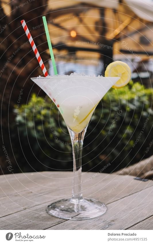 A margarita cocktail made with tequila, salt and lime served in a martini glass alcohol alcoholic background bar beverage bitter celebration citrus classic cold