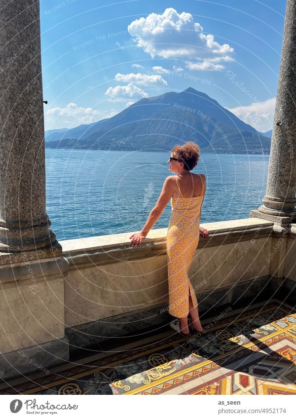 Woman at the lake Lake Lake Como Exterior shot Nature Mountain Italy Vacation & Travel Colour photo Landscape Water Summer Lakeside Sky Tourism Day Relaxation
