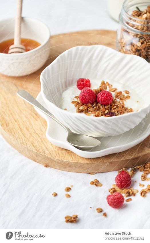 Yummy granola with honey and yogurt table healthy breakfast morning tasty sweet fresh dairy product delicious food dessert meal nutrition snack natural wooden