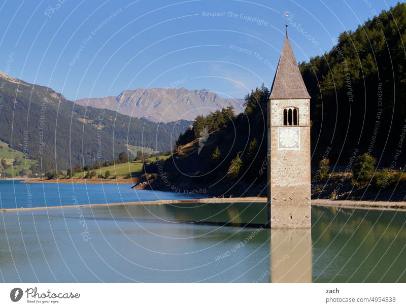 downfall Church Church spire Lake Reschen Water Mountain Alps Religion and faith Religion & Faith Reservoir submerged High tide Forest inundation South Tyrol