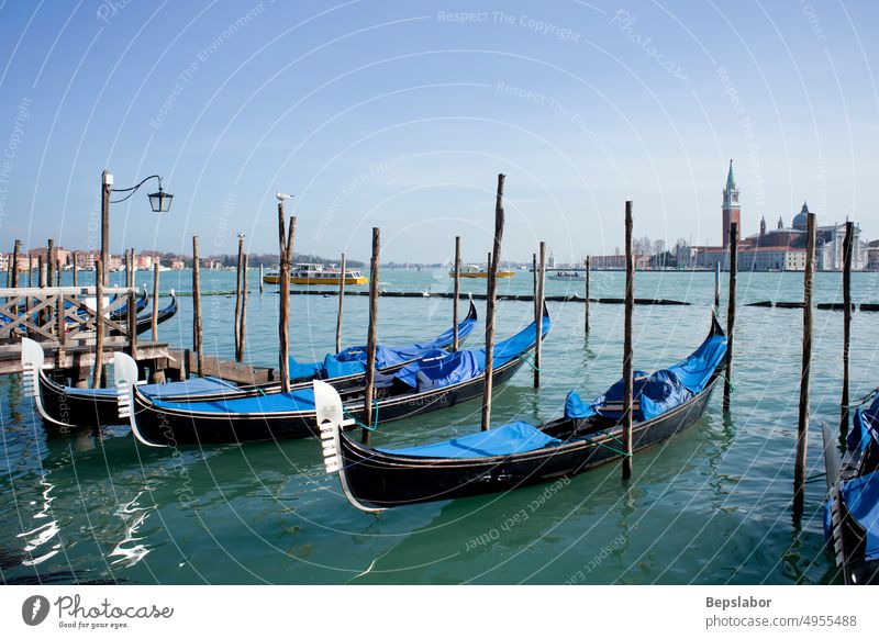 Gondolas parking in the traditional Venetian rowing boat architecture asset bank being billow canal card classic countryside craft fortune freight gondolier