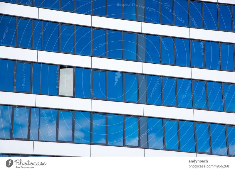 A glass facade with an open window architecture beautiful blue building Business city clean clear commercial concept copy space corporate design economy