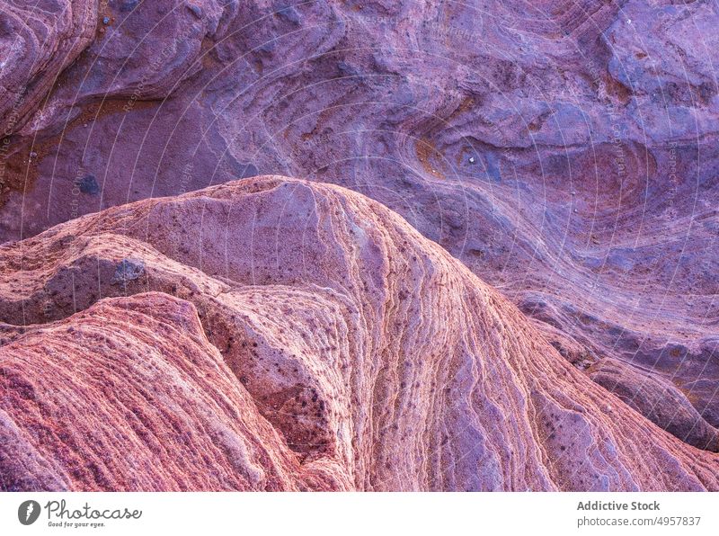 Rocky canyon with massive cliffs as textured background rocky formation abstract nature surface geology rough sandstone wild solid scenic colorful range mineral