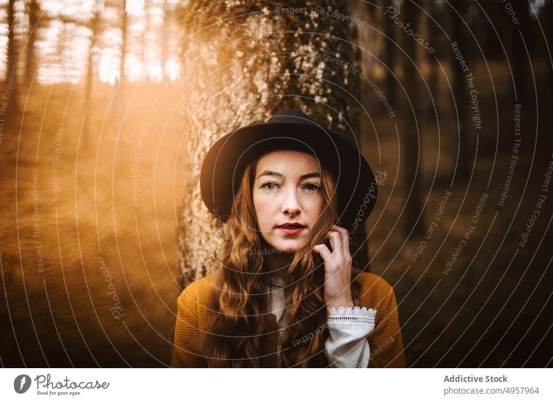 Young hipster woman in the countryside girl nature young person lifestyle hat summer model beauty hair outdoors casual background caucasian face stylish retro