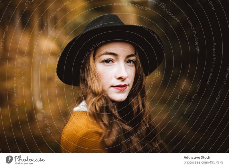 Young hipster woman in the countryside girl nature young person lifestyle hat summer model beauty hair outdoors casual background caucasian face stylish retro