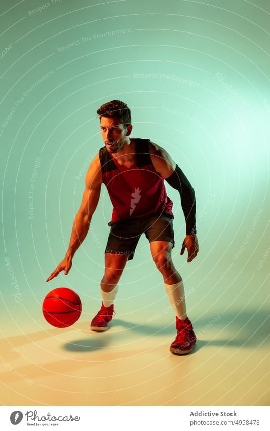Studio Shot Of Basketball Player In The Studio action advertising art athlete background basketball blur colorful competition concept contemporary creative dark
