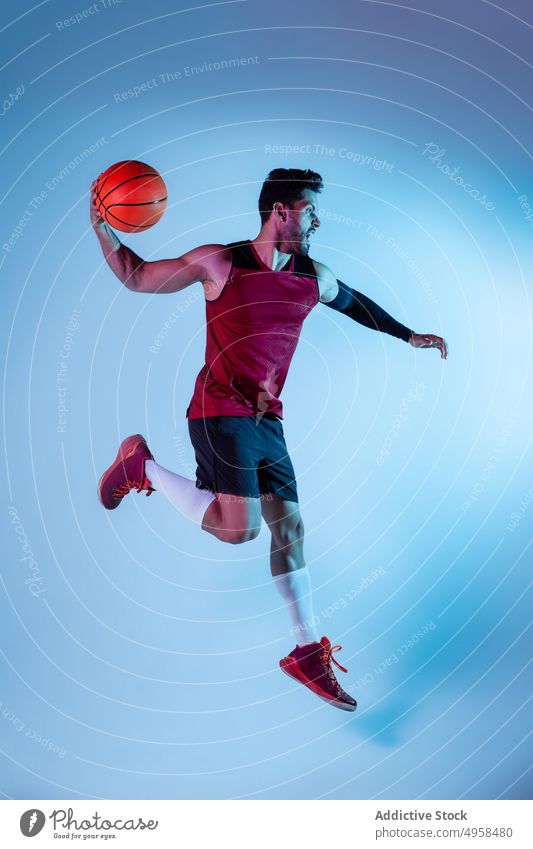 Studio Shot Of Basketball Player In The Studio action advertising art athlete background basketball blur colorful competition concept contemporary creative dark