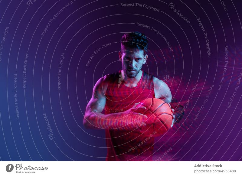 Studio Shot Of Basketball Player In The Studio with purple background action advertising art athlete basketball blur colorful competition concept contemporary