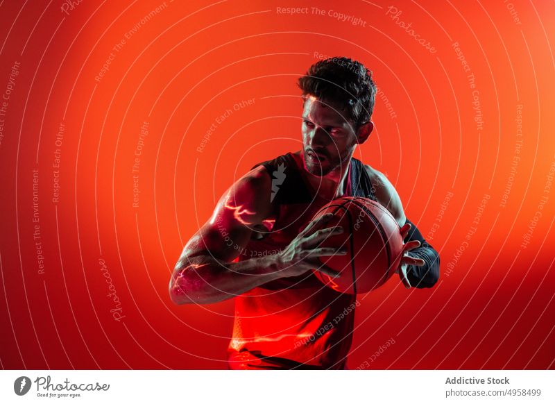 Studio Shot Of Basketball Player In The Studio with red background action advertising art athlete basketball blur colorful competition concept contemporary