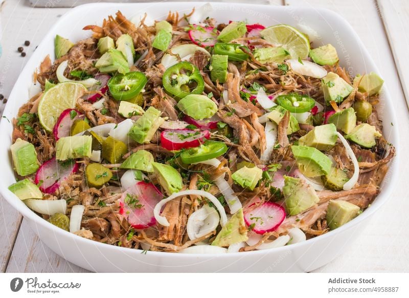 Cuban bowl with meat and slices of radish and jalapeno avocado lime delicious food pulled meat cuisine vegetable fresh piece cuban ingredient serve meal spicy