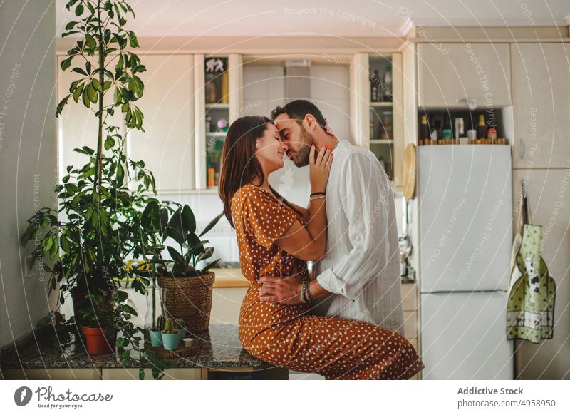 Latin couple hugging at home family indoors man people adult woman house two love happiness facial expression portrait togetherness room apartment boyfriend