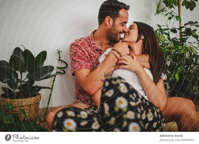 Latin couple hugging at home family indoors man people adult woman house two love happiness facial expression portrait togetherness room apartment boyfriend
