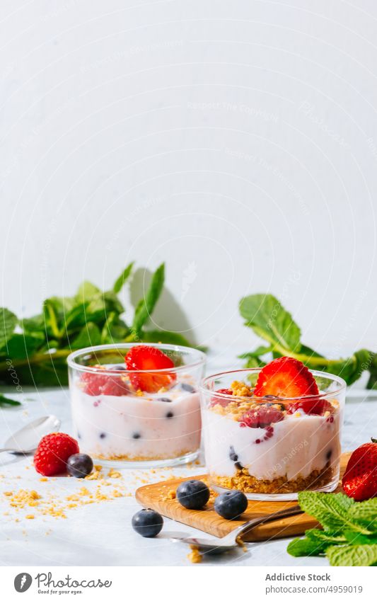 Strawberries and berries served with fresh yogurt sweet berry cream delicious fruit strawberry breakfast milk food creamy blueberry homemade bowl background