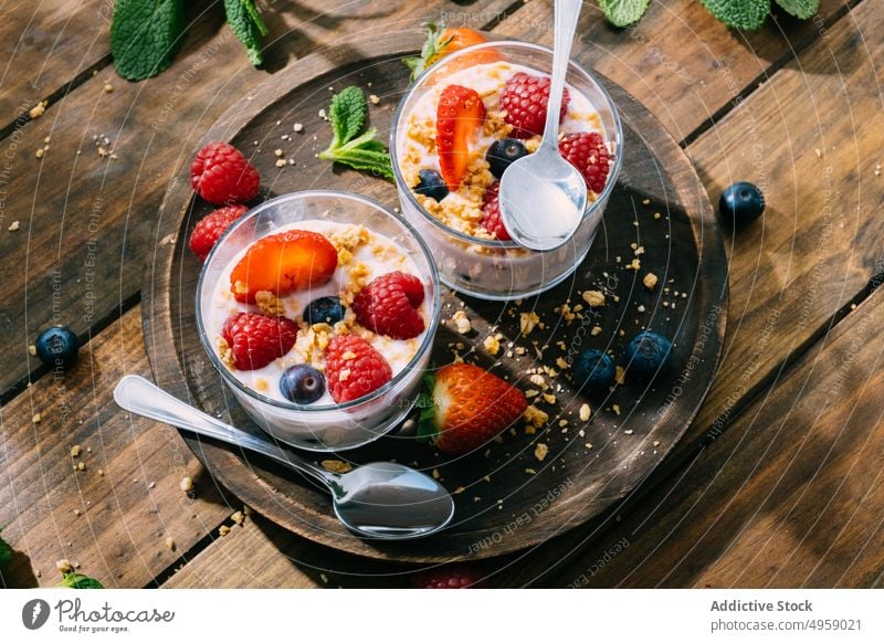 Strawberries and berries served with fresh yogurt sweet berry cream delicious fruit strawberry breakfast milk food creamy blueberry homemade bowl background