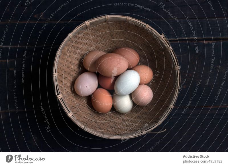 Top view of basket with eggs natural heap pile food ingredient raw chicken organic nature fresh health protein wicker season traditional breakfast wood cuisine