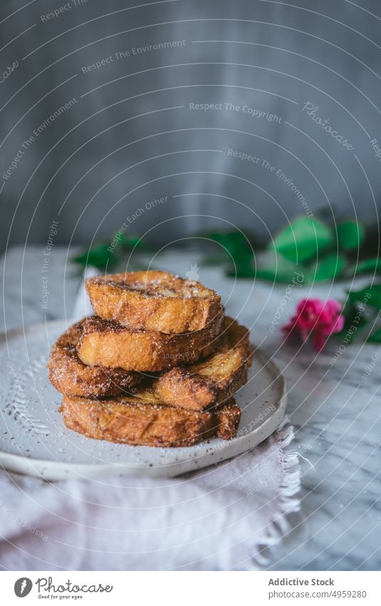 Typical homemade Spanish torrijas on marble table french toast spanish typical traditional bread slices dessert cinnamon culinary sweet breakfast tasty spain