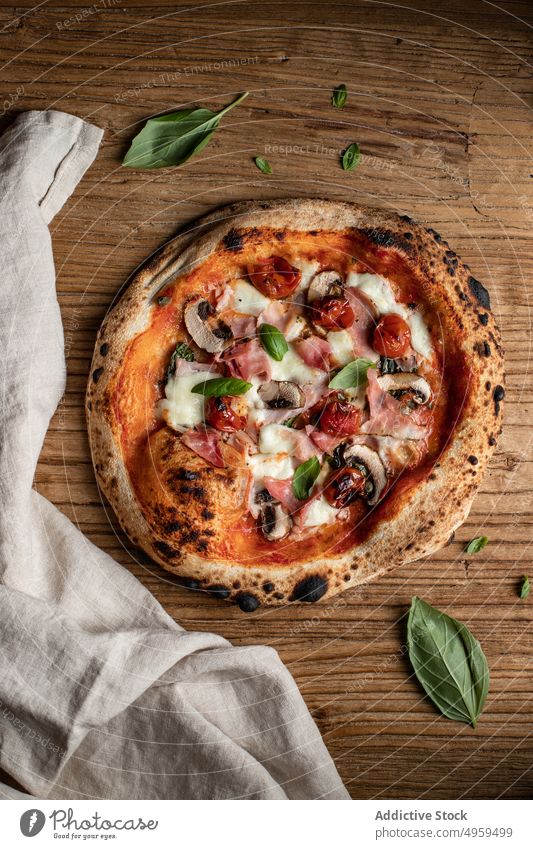 Tasty pizza with mushrooms and herbs on table delicious tasty food tomato basil kitchen yummy fresh lunch cuisine culinary ingredient nutrition dish palatable