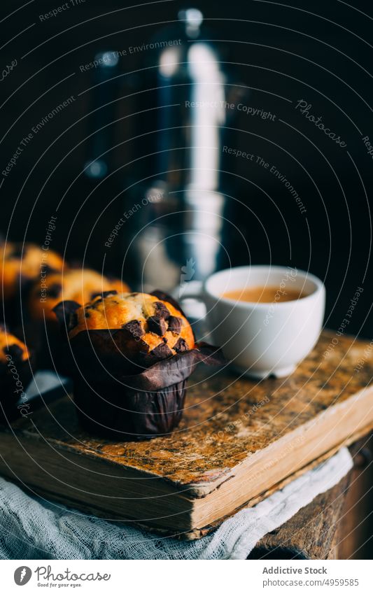 Chocolate muffins and coffee cup on dark background baked book breakfast butter cake chocolate cupcake dessert food sweet wooden fresh delicious tasty yummy