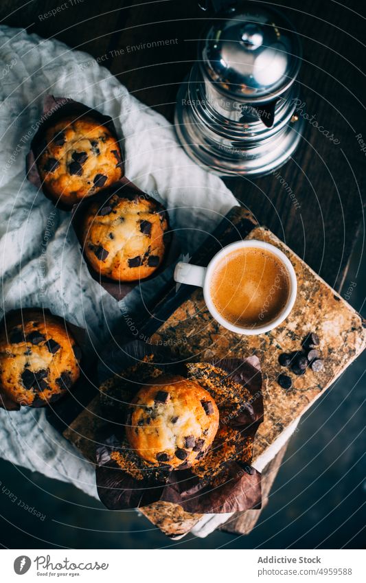 Chocolate muffins and coffee cup on dark background baked breakfast butter cake chocolate cupcake dessert food sweet wooden fresh delicious tasty yummy calories